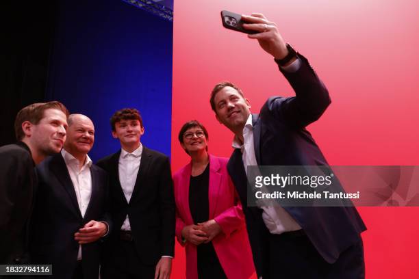 Saskia Esken and Lars Klingbeil, co-chairs of the German Social Democrats take a selfie with German Chancellor, Olaf Scholz , Kevin Kuehnert and the...