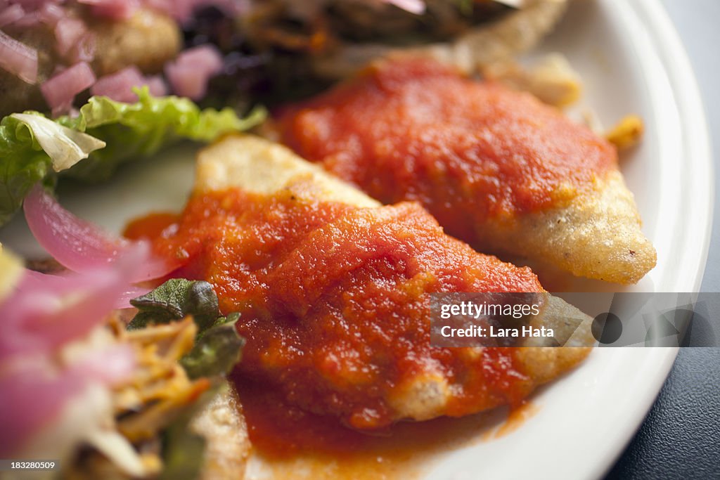 Empanadas with red chile sauce