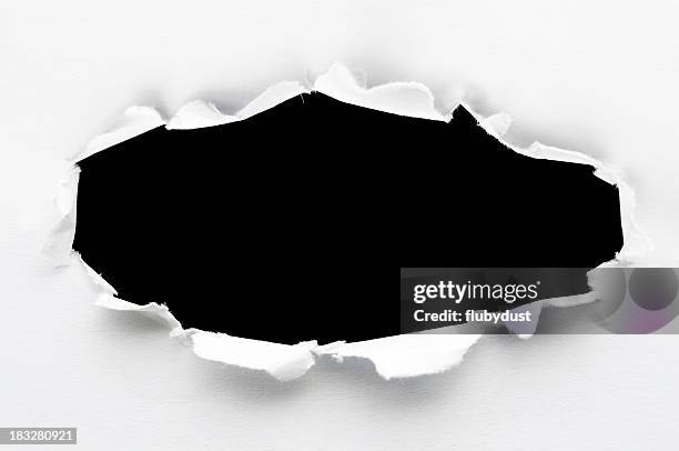 white paper ripped to create a black hole - hole stock pictures, royalty-free photos & images