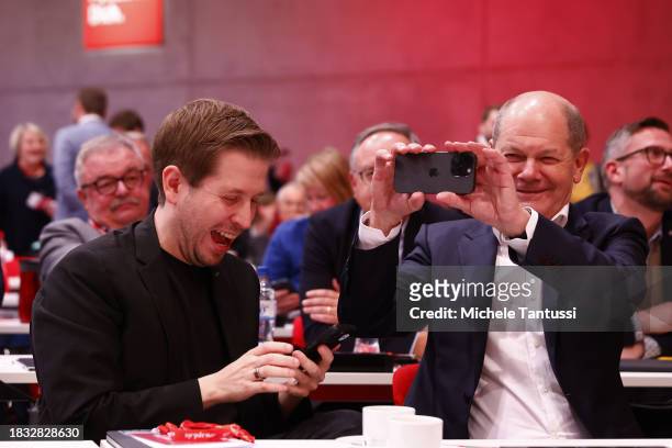 German Social Democrats and Kevin Kuehnert use their mobile phones at the SPD federal congress on December 8, 2023 in Berlin, Germany. The party is...