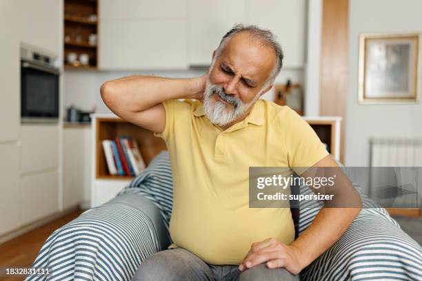 my nack pain is killing me - neuropathy stock pictures, royalty-free photos & images