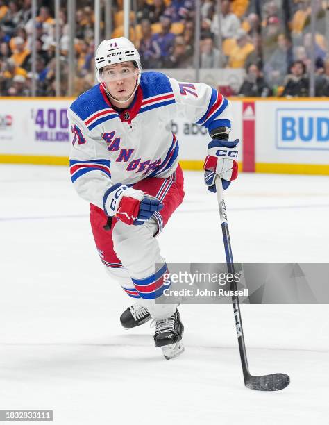 Tyler Pitlick of the New York Rangers skates against the Nashville Predators during an NHL game at Bridgestone Arena on December 2, 2023 in...