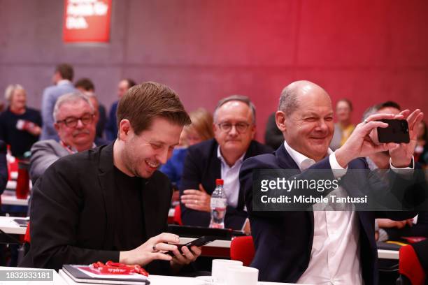 German Social Democrats and Kevin Kuehnert use their mobile phones at the SPD federal congress on December 8, 2023 in Berlin, Germany. The party is...