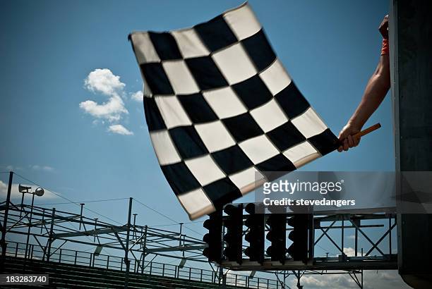 waving checkered flag - grand prix motor racing stock pictures, royalty-free photos & images