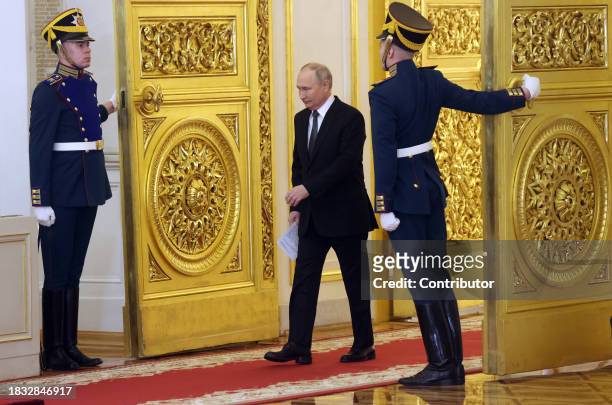 Russian President Vladimir Putin enters the hall of the Grand Kremlin Palace during the award ceremony, marking the Heroes of Russia Day on December...