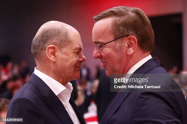 German Chancellor, Olaf Scholz chats with Defence Minister, Boris Pistorius at the SPD federal congress on December 8, 2023 in Berlin, Germany. The...