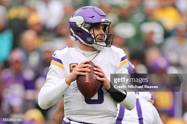 Kirk Cousins of the Minnesota Vikings looks to pass against the Green Bay Packers at Lambeau Field on October 29, 2023 in Green Bay, Wisconsin.