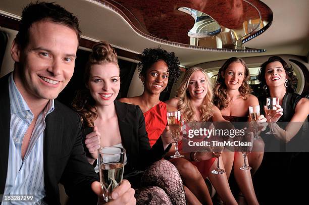 group  in  a limousine  having drinks on  way   to party - limousine stock pictures, royalty-free photos & images