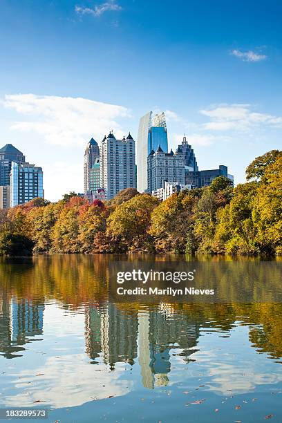 atlanta skyline reflecting in lake - atlanta georgia skyline stock pictures, royalty-free photos & images