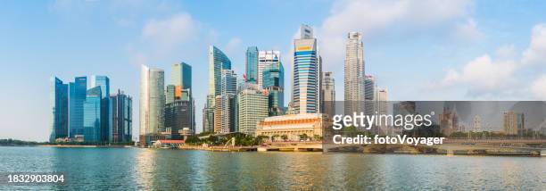 singapore central business district skyscrapers overlooking marina bay sunrise panorama - marina bay sands stock pictures, royalty-free photos & images