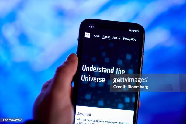 The xAI website on a smartphone arranged in New York, US, on Thursday, Dec. 7, 2023. Elon Musk's artificial intelligence company xAI is seeking to...