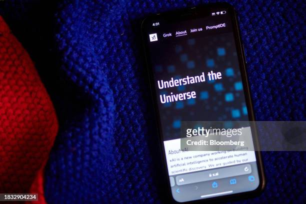 The xAI website on a smartphone arranged in New York, US, on Thursday, Dec. 7, 2023. Elon Musk's artificial intelligence company xAI is seeking to...