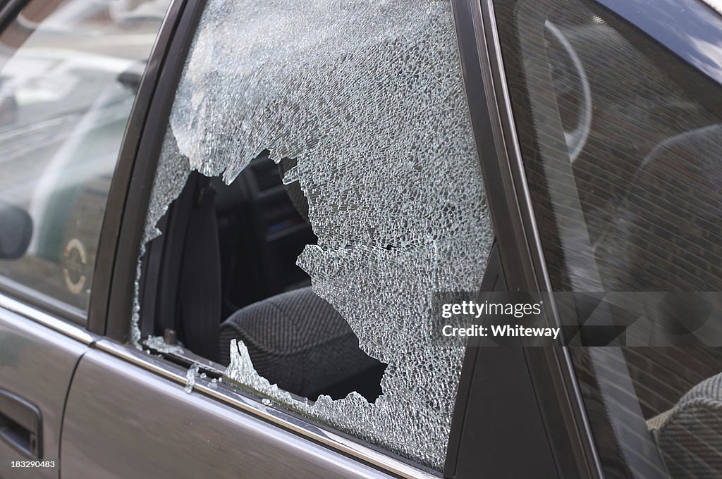 Thief broken glass in car window