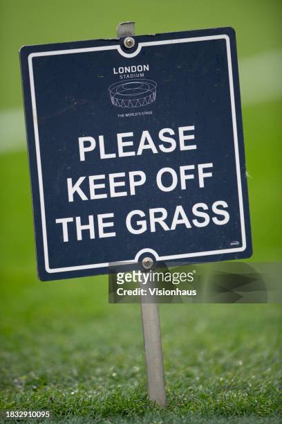 Detailed view of the Please Keep of the grass sign is seen prior to the Premier League match between West Ham United and Crystal Palace at London...