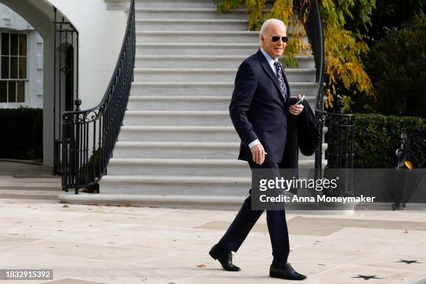 President Joe Biden walks to the South Lawn before boarding Marine One and departing the White House on December 05, 2023 in Washington, DC. Biden is...