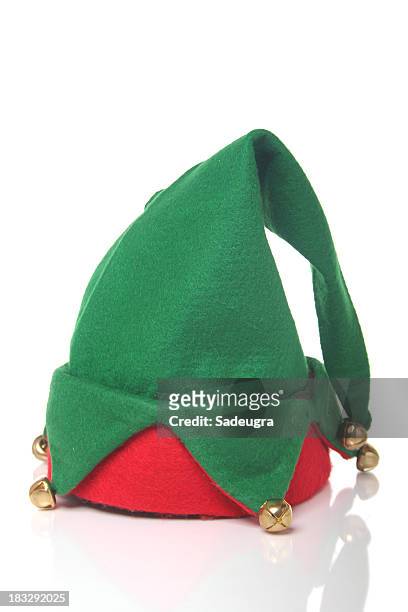 green and red elf hat with bells with a white background - hat stock pictures, royalty-free photos & images