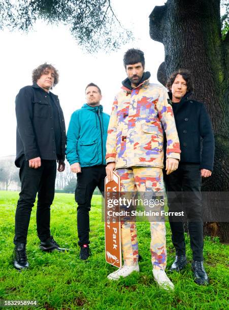 Ian Matthews, Chris Edwards, Serge Pizzorno and Tim Carter of Kasabian pose during a photocall for the announcement of Kasabian's show next summer in...