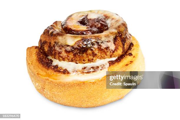 a tasty cinnamon bun with icing on a white background - coffee cake stock pictures, royalty-free photos & images