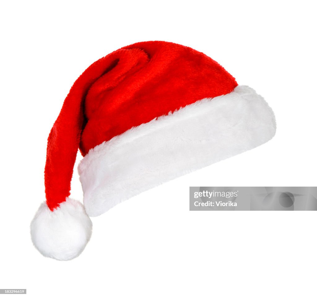 A festive red and white Santa hat on a white background