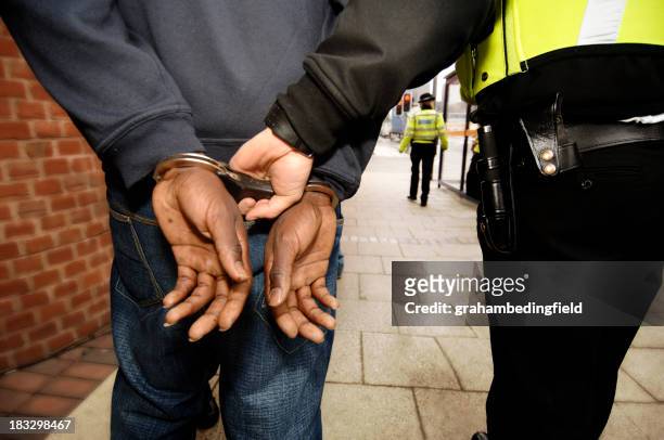 arrested - police uk stock pictures, royalty-free photos & images