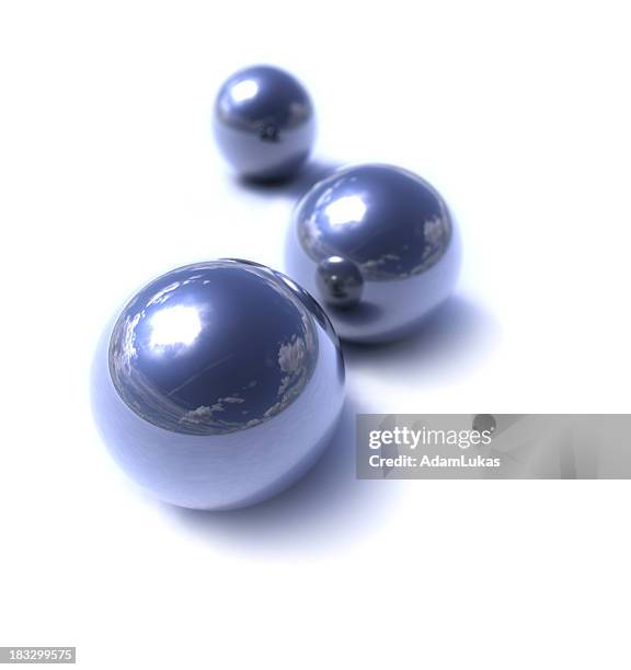 three metallic marbles on white background - mirror ball background stock pictures, royalty-free photos & images