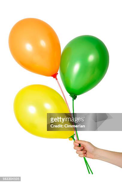 balloons in a hand - three balloons stock pictures, royalty-free photos & images