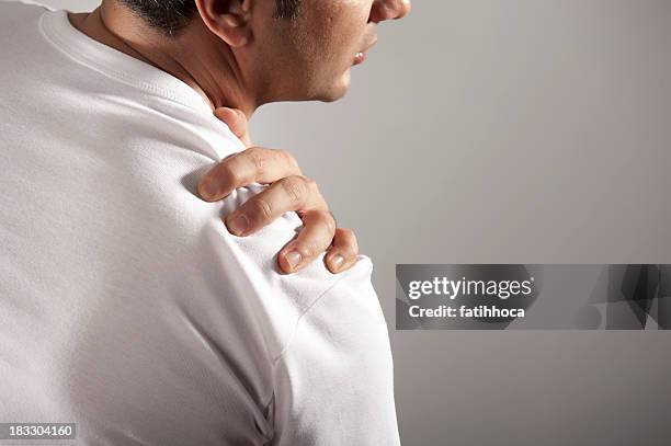 shoulder pain - stiff shoulder stock pictures, royalty-free photos & images