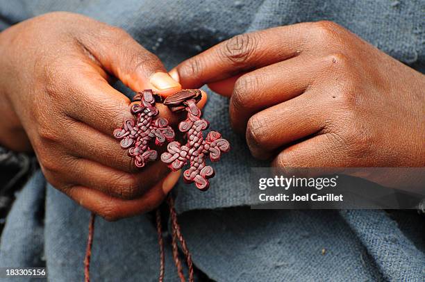 boy holding leather crosses in lalibela, ethiopia - orthodox stock pictures, royalty-free photos & images