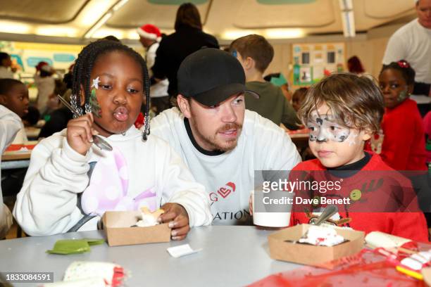 Will Poulter attends The Caring Family Foundation's "Food from the Heart" Campaign at Surrey Square Primary School with Bill's, The Ivy, Caprice...