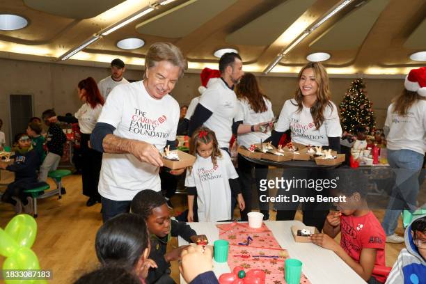 Richard Caring and Patricia Caring attend The Caring Family Foundation's "Food from the Heart" Campaign at Surrey Square Primary School with Bill's,...