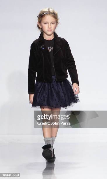 Model walks the IKKS Junior preview during the Swarovski at petiteParade NY Kids Fashion Week in Collaboration with VOGUEbambini on October 5, 2013...