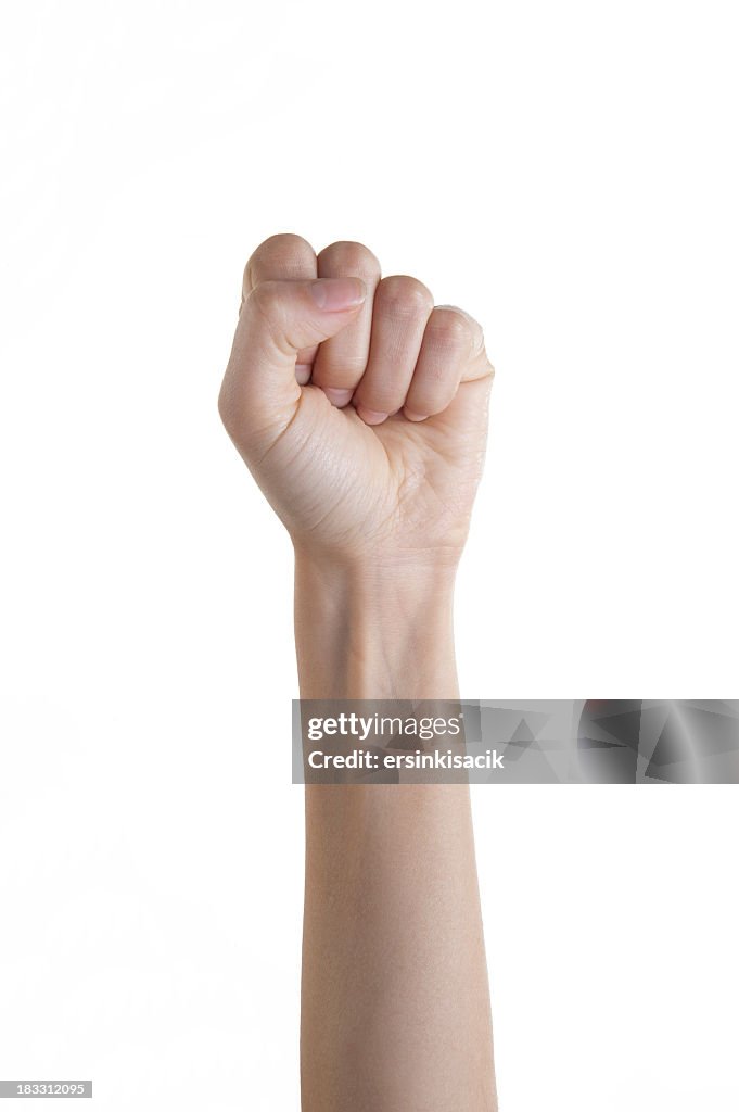 Isolated woman's fist punching upward