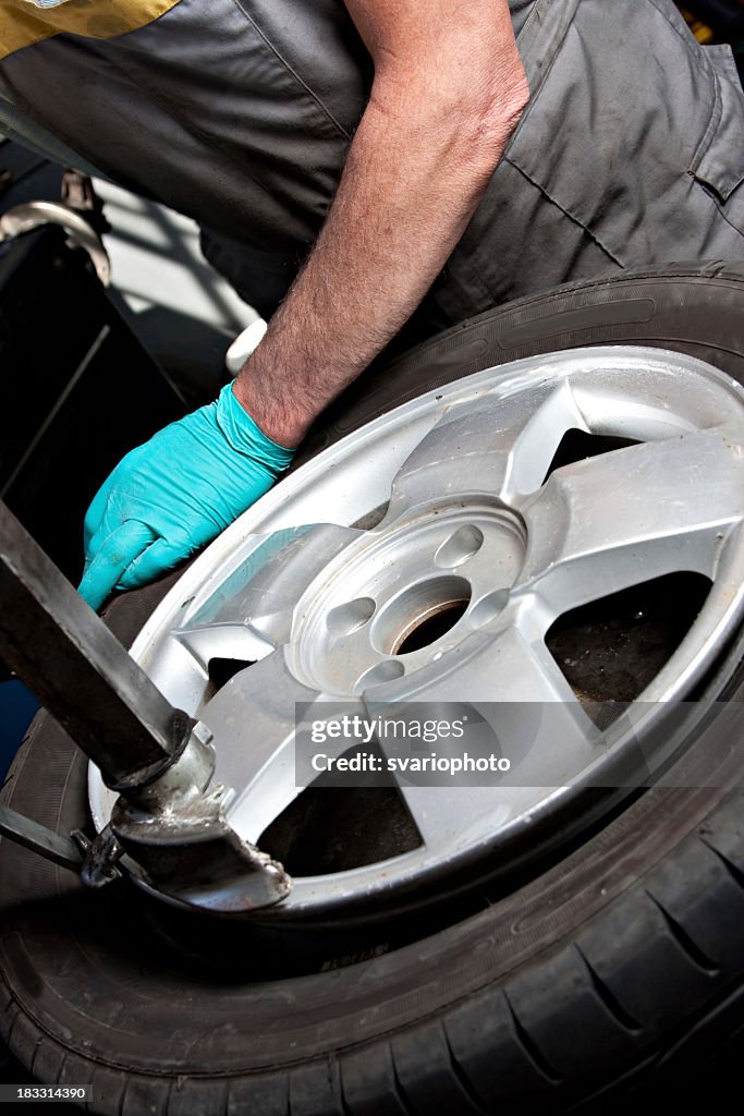 Mechanical repairs a tire.