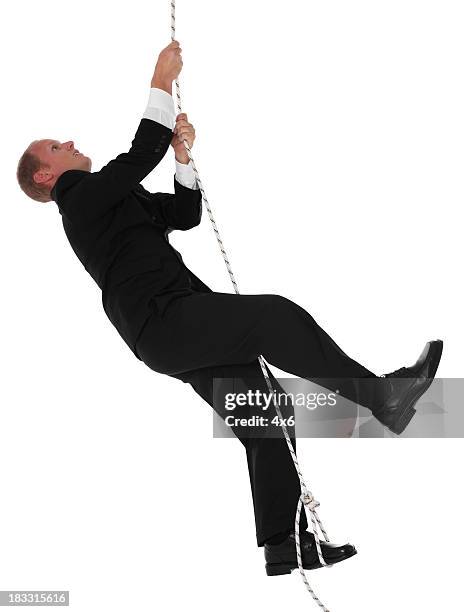 Men In Ropes 3,876 Man Hanging On A Rope Stock Photos, High-Res Pictures, and Images ...