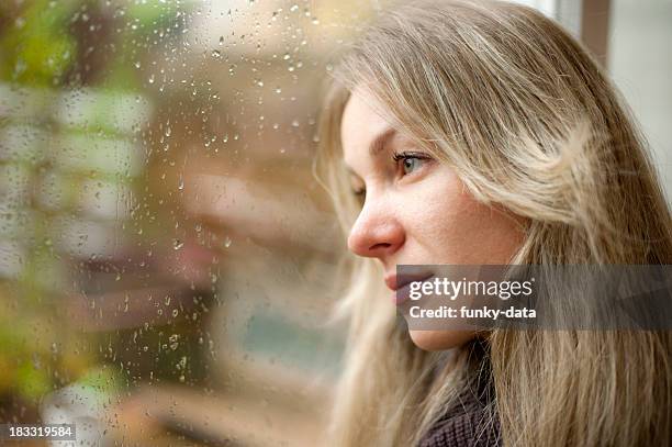 blond girl looking far away - staring up stock pictures, royalty-free photos & images