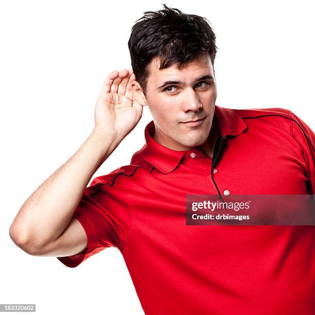 man listening with hand cupped around ear - polo shirt stock pictures, royalty-free photos & images