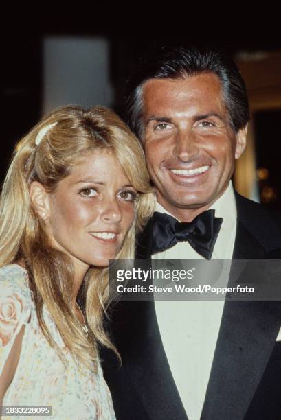 American actors George Hamilton and Liz Treadwell during Cannes Film Festival on May 24, 1979 in Cannes, France.