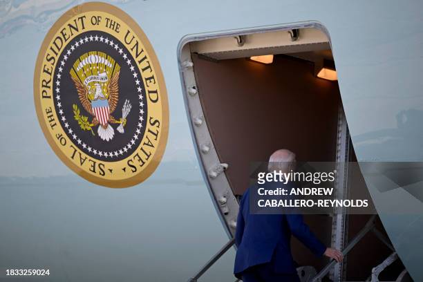 President Joe Biden boards Air Force One at Joint Base Andrews in Maryland on December 8, 2023. Biden will travel to Las Vegas, Nevada, to deliver...