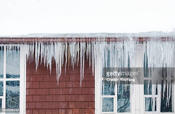 ice dams, snow on roof, icicles causing winter house damage - icicle stock pictures, royalty-free photos & images