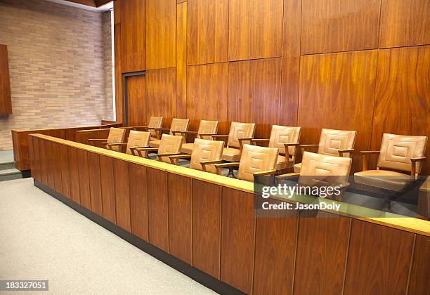 empty wooden courtroom jury box with beige leather chairs - jury stock pictures, royalty-free photos & images