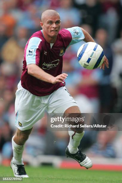 September 24: Paul Konchesky of West Ham United on the ball during the Premier League match between West Ham United and Arsenal at Upton Park on...