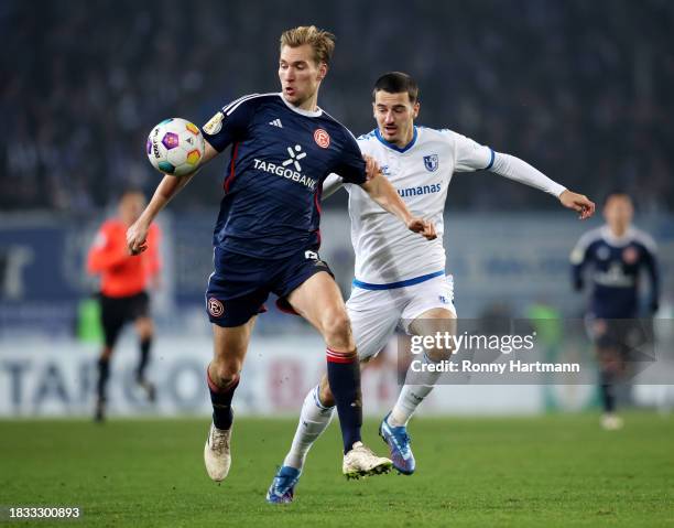 Vincent Vermeij of Fortuna Duesseldorf and Andi Hoti of 1. FC Magdeburg battle for the ball during the DFB cup round of 16 match between 1. FC...