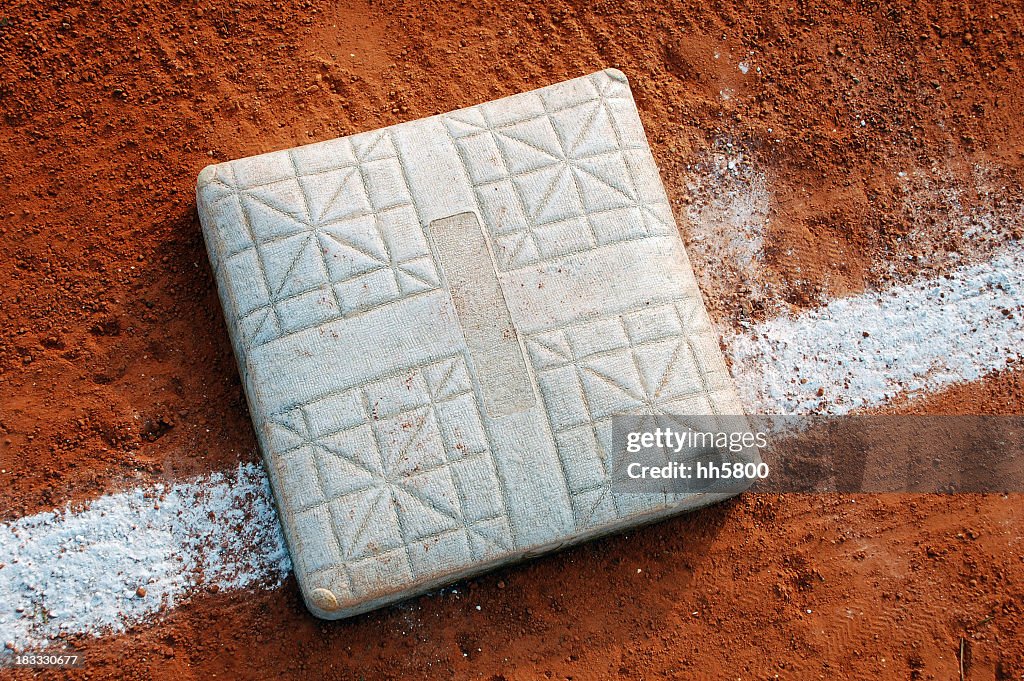 Close-up view of a baseball base on the field