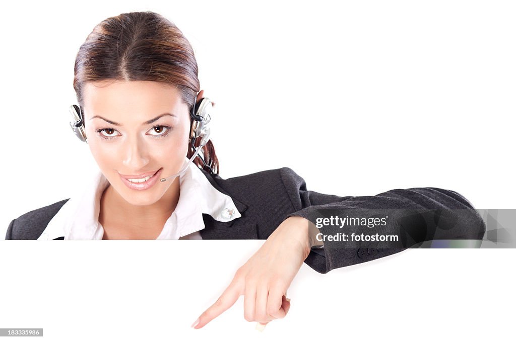 Technical support - businesswoman pointing and showing blank banner sign