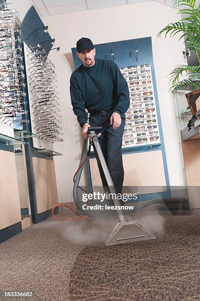 a professional carpet cleaner at work - clean carpet stock pictures, royalty-free photos & images