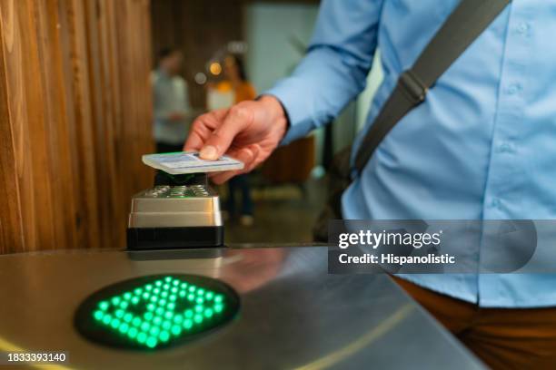 close-up on a man entering a building and scanning his id card at the door - entry card stock pictures, royalty-free photos & images