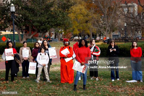 Activists listen during a Title IX rally at Lafayette Park near the White House on December 05, 2023 in Washington, DC. Activists and students...