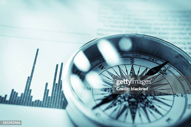 investment guidance - navigational compass stockfoto's en -beelden