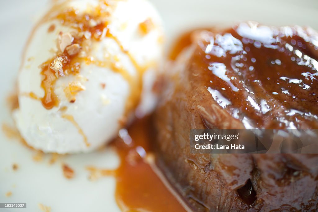 A close-up shot of persimmon pudding with sauce
