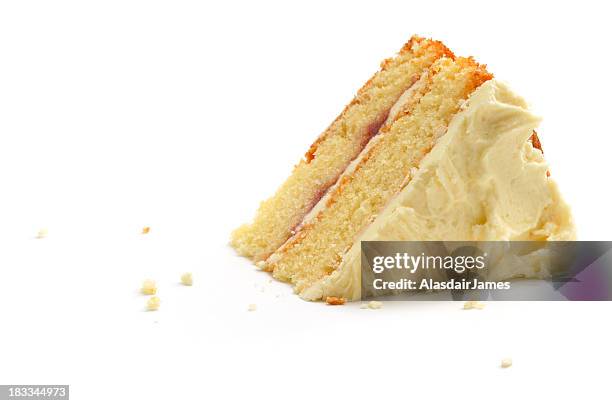 triangular piece of cake over white background - cake slice stock pictures, royalty-free photos & images